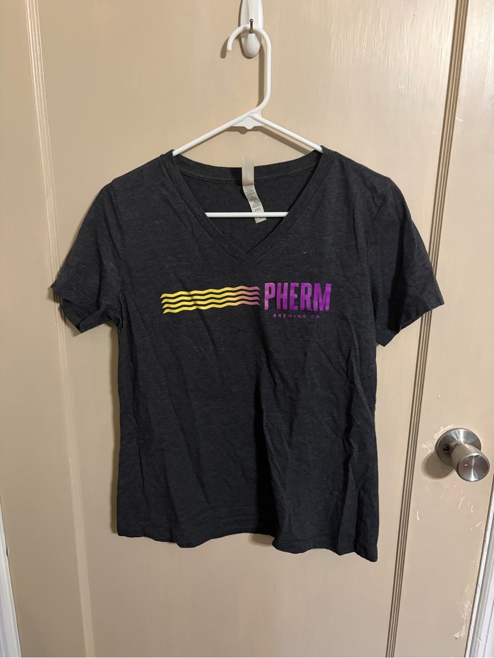 Bella Canvas Black V-Neck Tee with Purple Logo and Yellow Accent